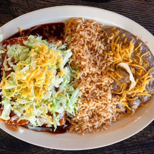 Enchilada Combination plate W/ Soda & Side.